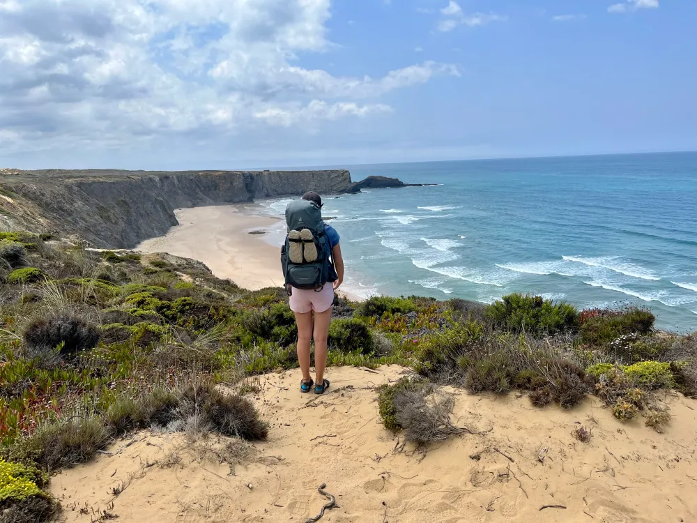 Aleks looking out onto the ocean from a cliff